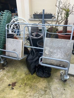 two carts that are next to each other on the ground