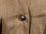 a close up of a jacket with buttons on it