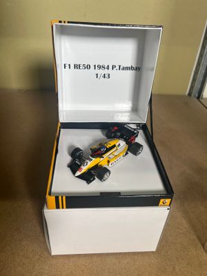 a toy car that is in a box on a table