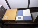 two boxes that are stacked on top of each other