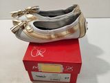 pair of women ' s shoes on a red box on a white surface