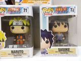 two boxes of pop hero naruto and sasuke action figures