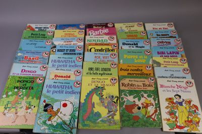 many children ' s books that are lined up on a table