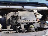 a car engine with the hood up and the hood down