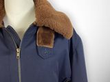 navy blue jacket with brown fur collar on mannequin mannequin mannequin mannequin mannequin mannequin mannequin mannequin