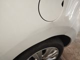a close up of a car ' s tire with a hole in the center