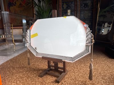 a table with a mirror on top of it in a living room