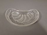 a glass bowl with a design on it on a table