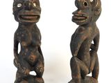 pair of carved wooden figures of a monkey and a frog