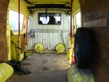 a yellow van that is parked inside of a building