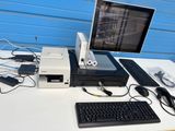 a desktop computer sitting on top of a desk next to a keyboard and mouse