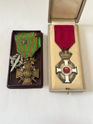two medals sitting in a box on a table