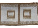an image of a brown and white rug with two squares on it