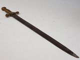 an old sword with a wooden handle on a white surface