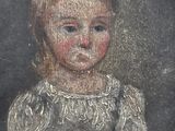 portrait of a young girl in a white dress in a wooden frame