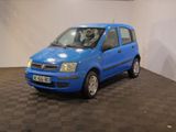 a small blue car that is parked in a room