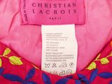 a close up of a label on a pink dress with blue and yellow flowers