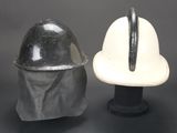 two helmets sitting next to each other on a table