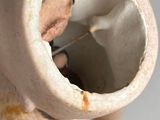 a close up of a vase on a table