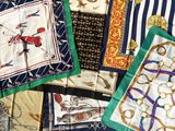 several different types of scarves are laid out on a white surface
