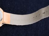 a close up of a wrist watch with a leather band