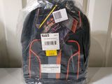 a bag of luggage sitting on a table with a price tag on it