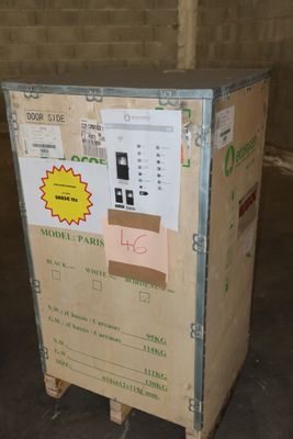 a cardboard box with a sticker on it sitting on a pallet