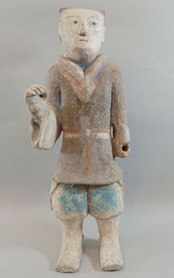 statue of a man holding a bird in his right hand