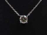 a diamond necklace on a mannequin necklace