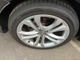 a close up of a tire on a car ' s rim