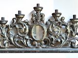 a silver candle holder with a mirror on top of it