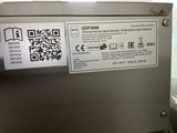 a close up of a machine with qr code on it