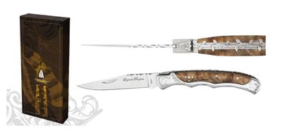 the knife is next to a box with a knife inside of it