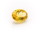 a yellow sapphire gems on a white background