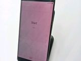 a cell phone that is sitting on top of a stand