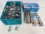 a box of screws and a box of nails on a table