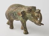 statue of an elephant on a white surface with a white background