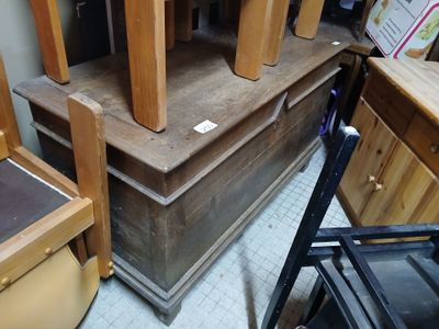 a stack of wooden chairs sitting on top of each other