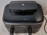 a black printer sitting on top of a white counter