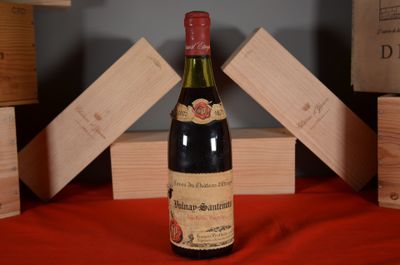 a bottle of wine that is sitting on a table