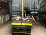a workbench in the middle of a garage with a lot of tools on it