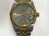 an image of a silver and gold rolex watch on a white background