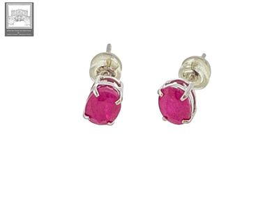 a pair of pink stone stud earrings on a white background