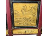 yellow and red painted cabinet with a painting of a landscape on it