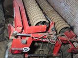 an image of a tractor that is parked in a barn