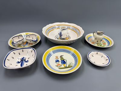 many plates and bowls that are sitting on a table