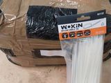 a box with a bunch of white sticks in it