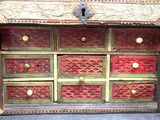 a wooden chest of drawers with many drawers in it