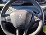 dashboard view of a car with a steering wheel and dashboard controls