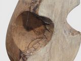 an image of a wooden sculpture with a hole in the middle